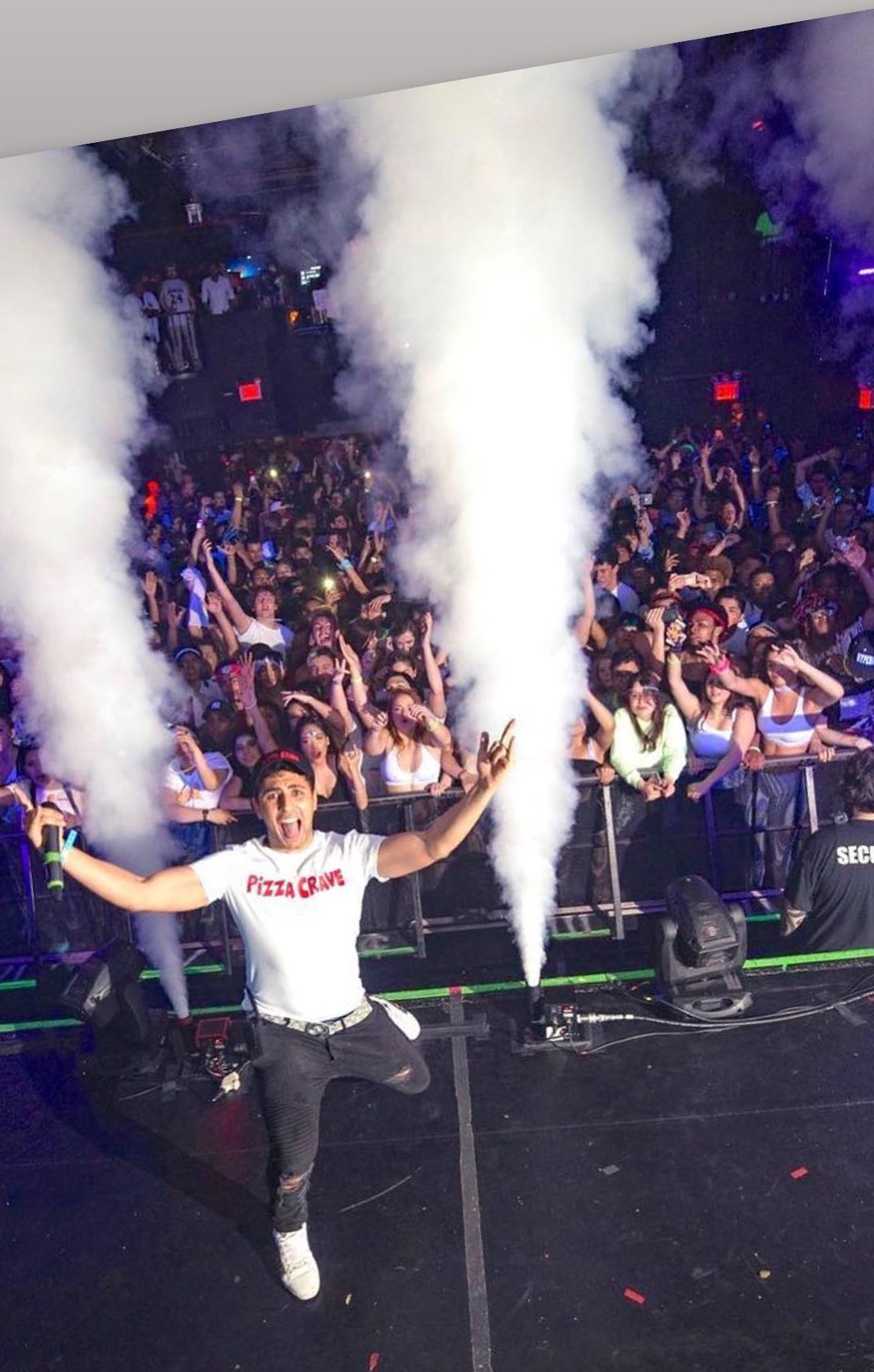Adam Zak onstage during a large live event