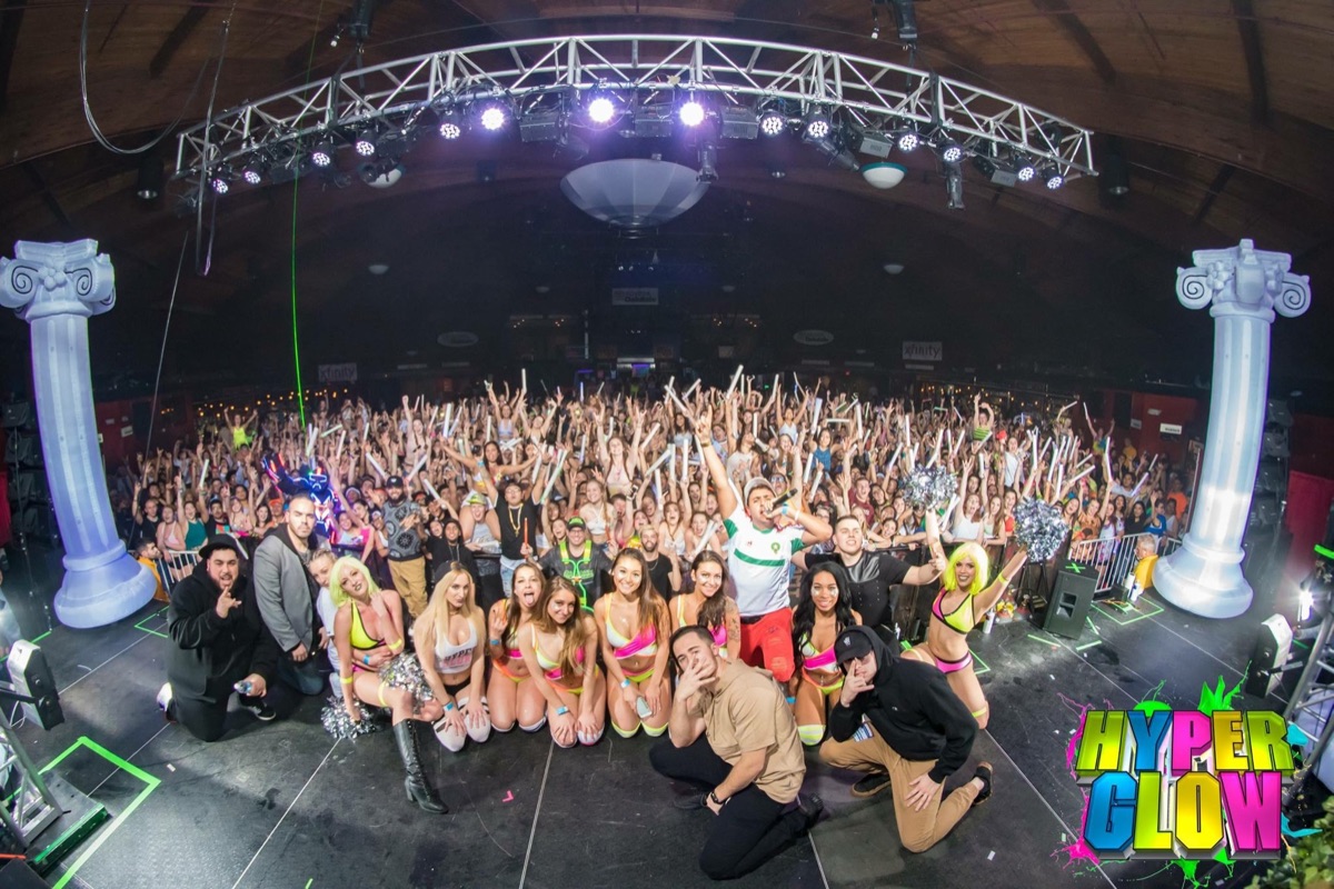 Hyperglow performers and production team in front of a large live-event audience